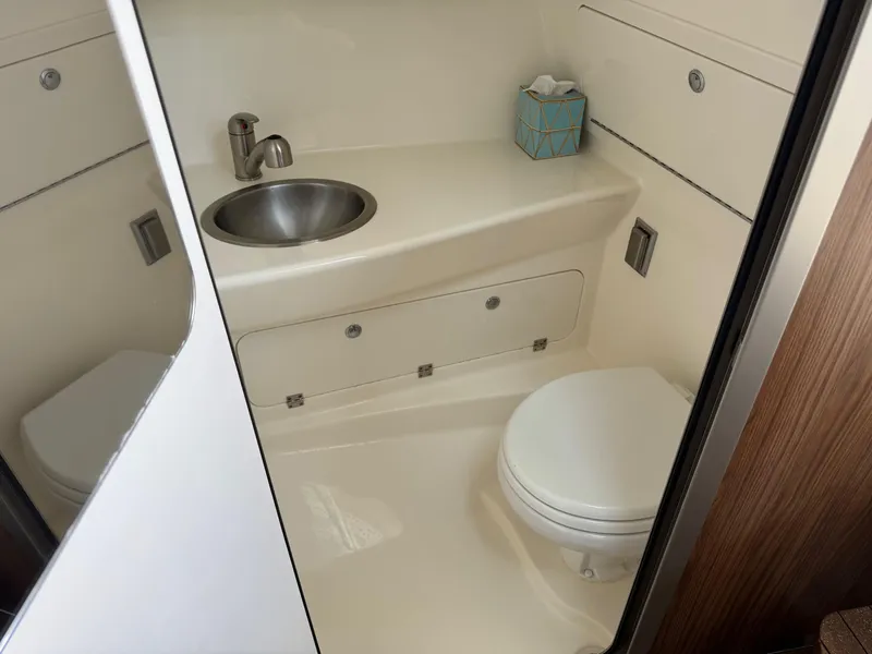Slide: The Image of 2022 Boston Whaler 285 Conquest bathroom with sink and toilet. - 10