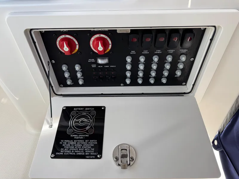 Slide: The Image of Control panel of a 2022 Boston Whaler 285 Conquest boat, featuring battery switches and circuit controls. - 19
