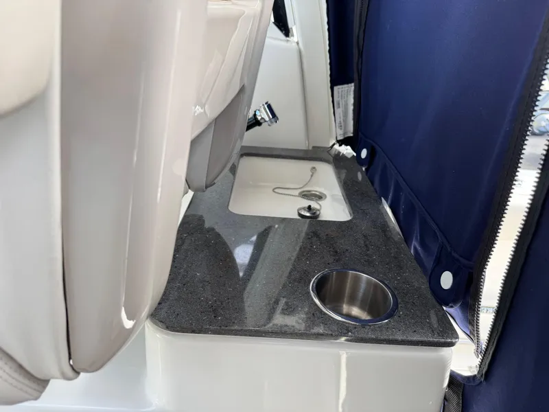 Slide: The Image of Interior of 2022 Boston Whaler 285 Conquest with sink and cup holder. - 20