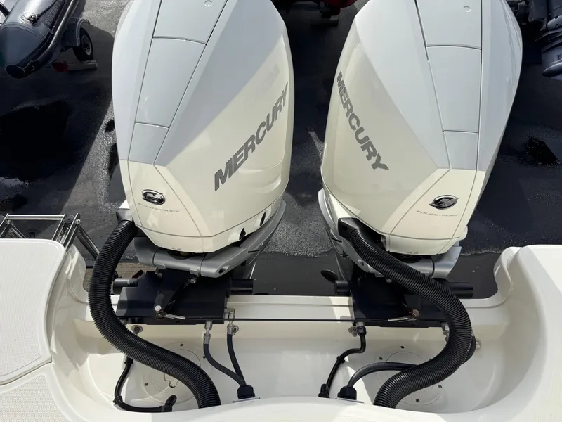 Slide: The Image of Twin Mercury outboard engines on a 2022 Boston Whaler 285 Conquest boat. - 28