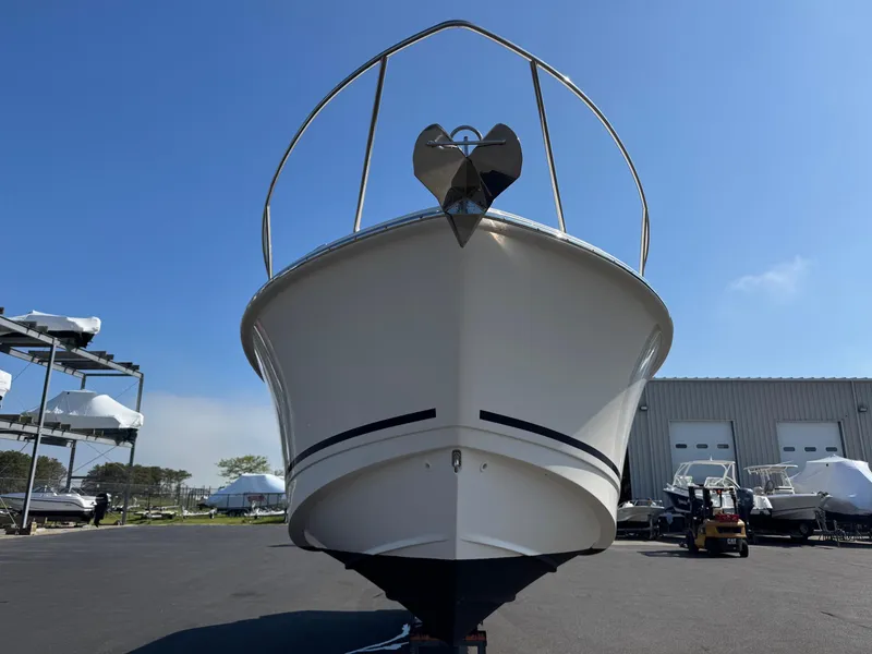 Slide: The Image of 2022 Boston Whaler 285 Conquest boat on display under clear blue sky. - 5