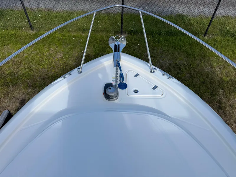 Slide: The Image of Bow view of 2022 Boston Whaler 285 Conquest boat, featuring anchor and railing. - 6