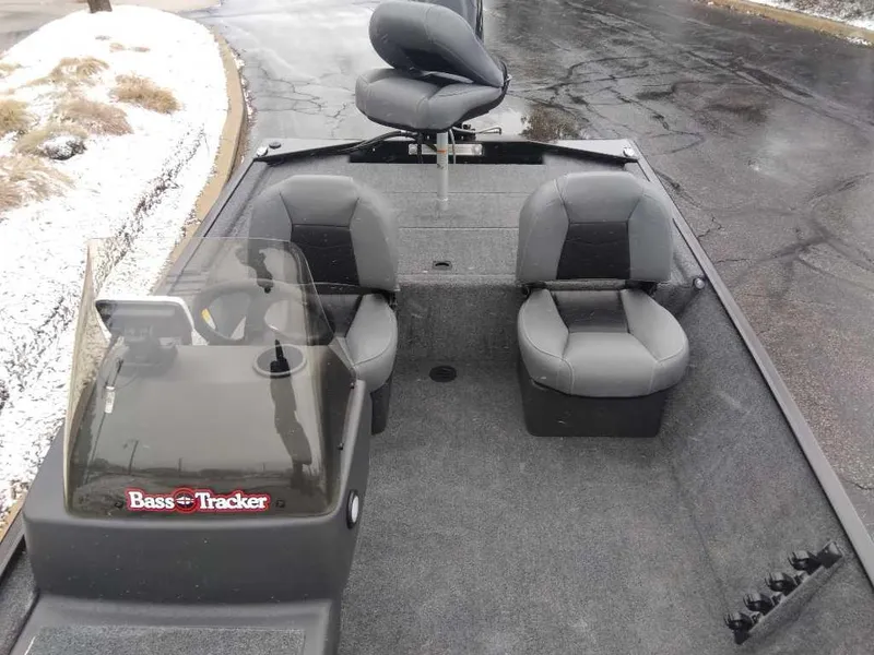 Slide: The Image of 2025 Tracker Bass Tracker Classic XL boat interior with three gray seats. - 3