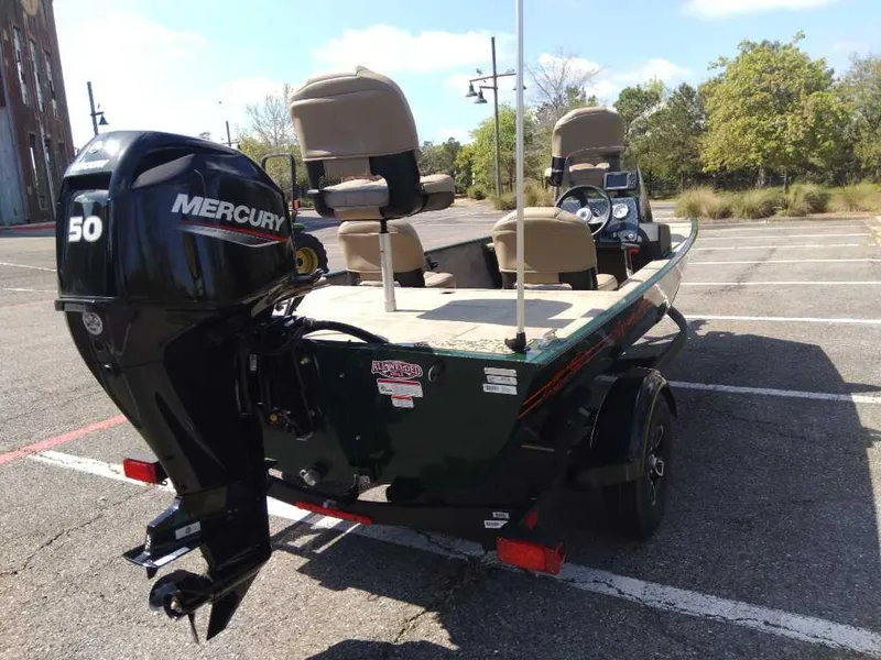 Slide: The Image of 2025 Tracker Bass Tracker Classic Limited boat with Mercury 50 engine in parking lot. - 4