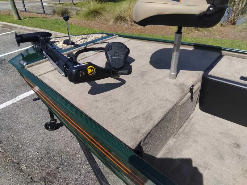 Slide: The Image of 2025 Tracker Bass Tracker Classic Limited boat deck with trolling motor and seat. - 8