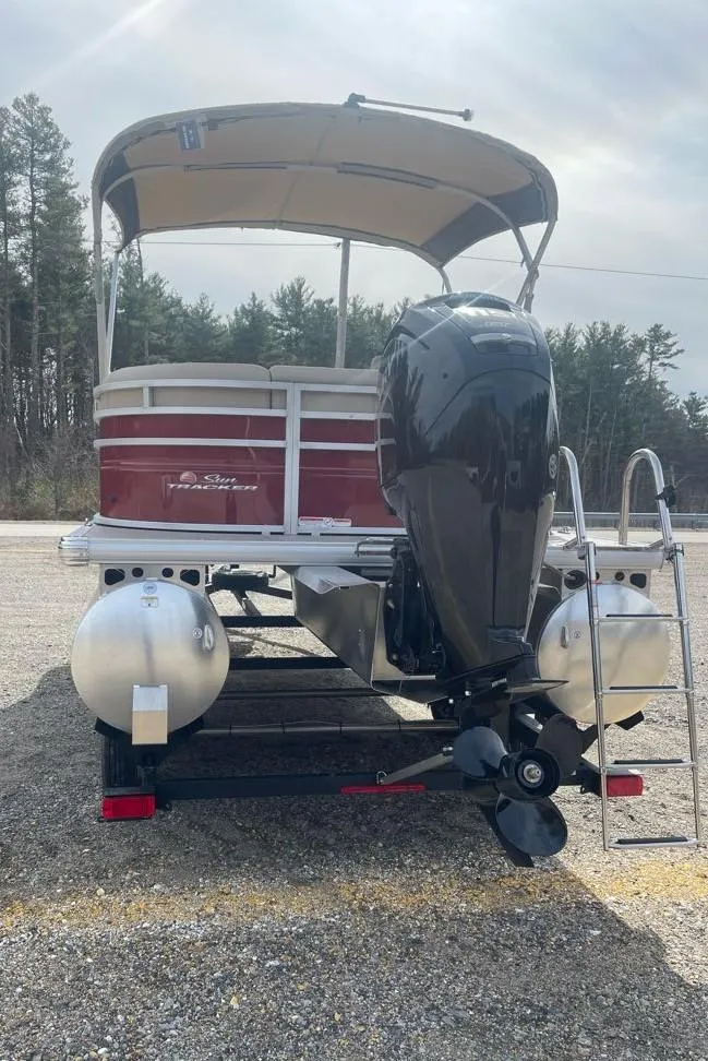 Slide: The Image of 2025 Sun Tracker Party Barge 20 DLX pontoon boat with outboard motor and canopy. - 8