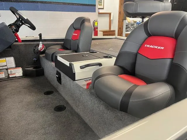 Slide: The Image of 2025 Tracker Savage 215 boat interior with gray and red seating. - 5