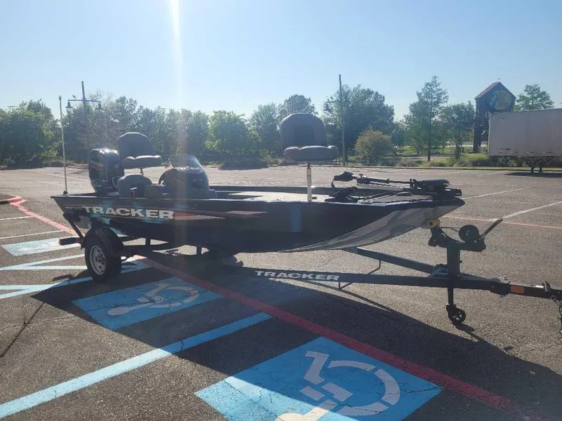 Slide: The Image of 2025 Tracker Pro 170 boat on trailer in parking lot, sunny day. - 4