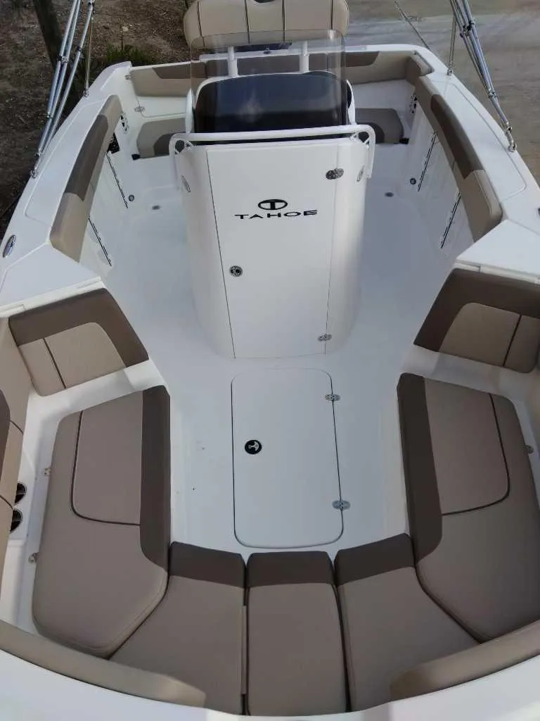 Slide: The Image of 2025 Tahoe 2150 CC boat interior with spacious seating and modern design. - 2