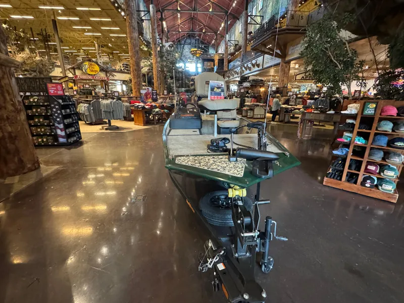 Slide: The Image of 2025 Tracker Bass Tracker Classic Limited boat displayed in a large retail store. - 3