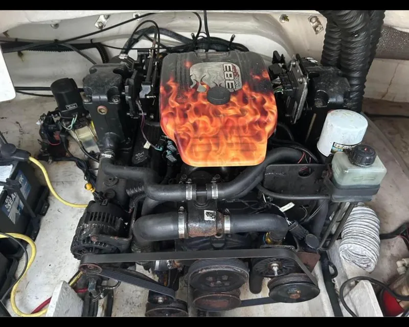 Slide: The Image of Engine of a 2004 Chaparral 230 SSi boat with custom flame design cover. - 2