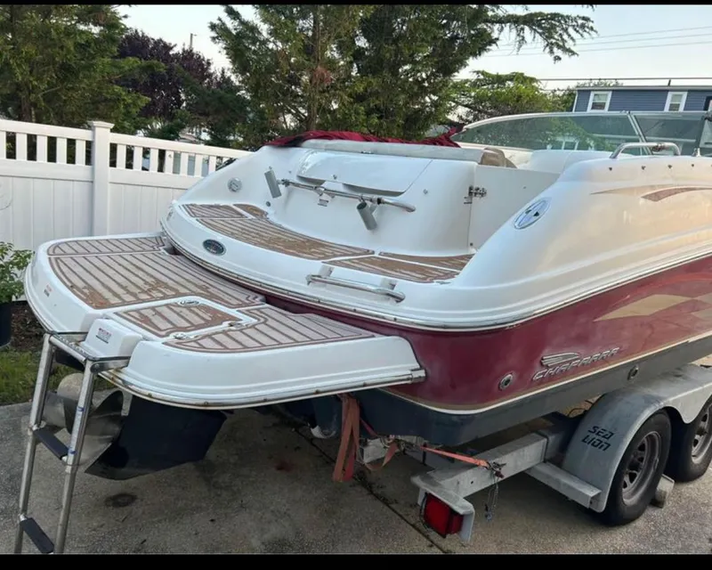 Slide: The Image of 2004 Chaparral 230 SSi boat on trailer, featuring a red and white exterior. - 3