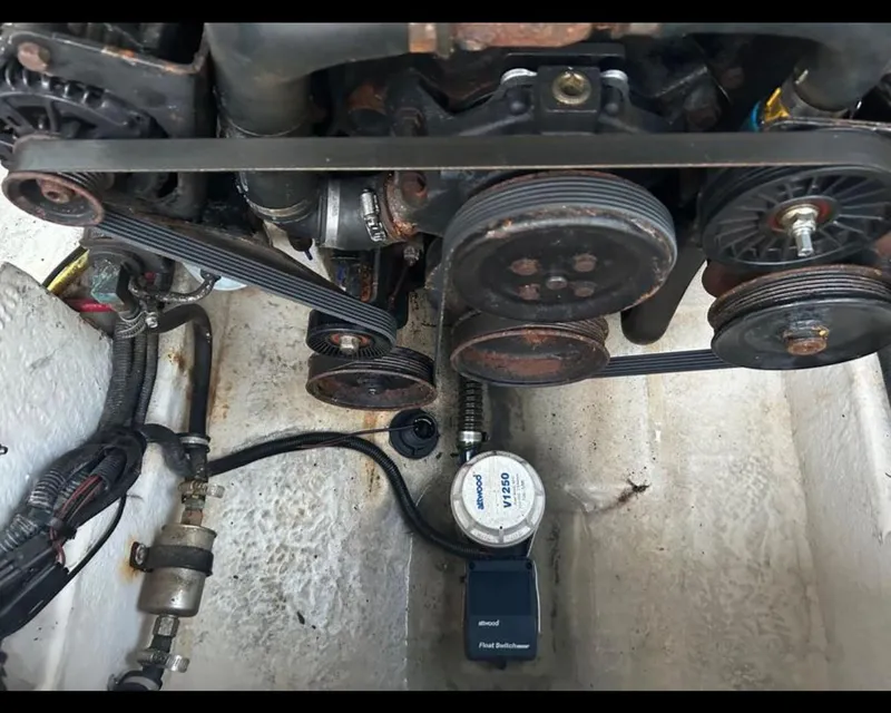 Slide: The Image of Engine components of a 2004 Chaparral 230 SSi boat, showing belts and pulleys. - 5