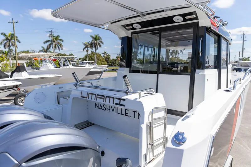 Slide: The Image of 2022 Jeanneau NC Sport 895 boat with dual engines, docked in a sunny marina. - 17