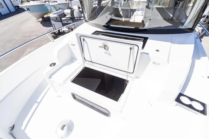 Slide: The Image of 2022 Jeanneau NC Sport 895 boat deck with open storage compartment. - 21