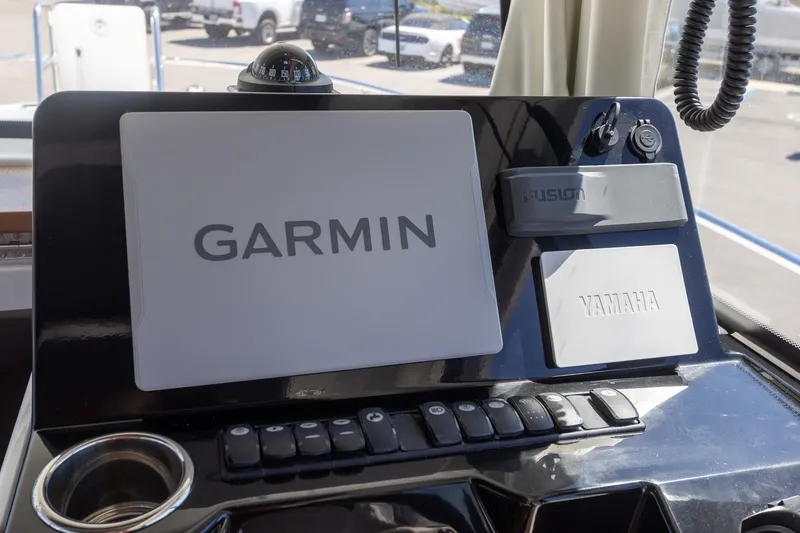 Slide: The Image of Control panel of 2022 Jeanneau NC Sport 895 with Garmin and Yamaha displays. - 28