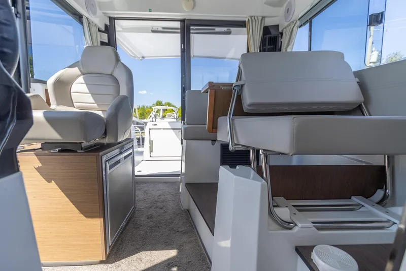 Slide: The Image of Interior of 2022 Jeanneau NC Sport 895 boat, featuring modern seating and sleek design. - 9
