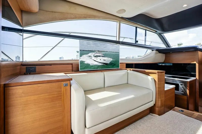 Slide: The Image of Luxurious interior of 2019 Princess 43 Flybridge yacht with modern seating and panoramic windows. - 15