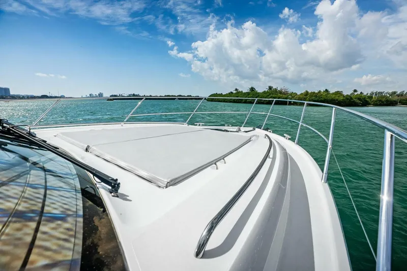 Slide: The Image of 2019 Princess 43 Flybridge yacht cruising on clear blue waters under a sunny sky. - 38