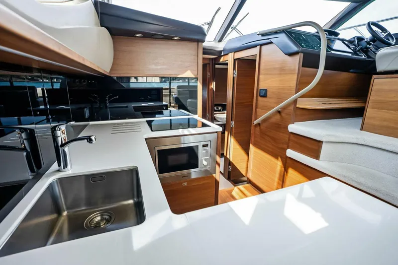 Slide: The Image of Luxurious interior of 2019 Princess 43 Flybridge yacht with modern kitchen amenities. - 7