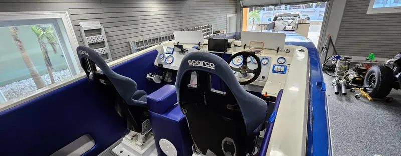 Slide: The Image of Interior of a 2003 Ultimate Warlock 29 World Class Offshore Race boat with Sparco seats. - 10
