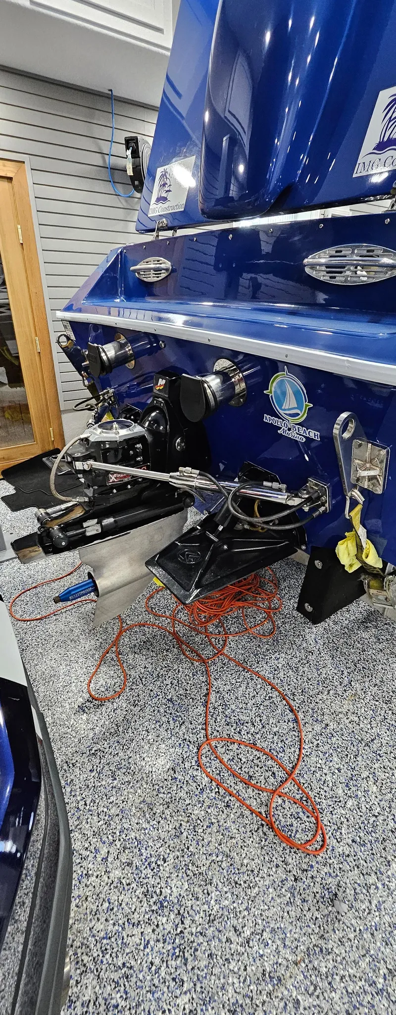 Slide: The Image of Rear view of a 2003 Ultimate Warlock 29 World Class Offshore Race boat in a garage. - 19