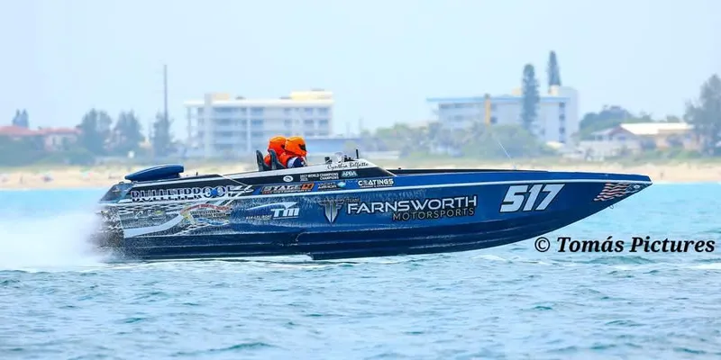 Slide: The Image of Offshore race boat "Ultimate Warlock 29" speeding on water, 2003 model. - 2