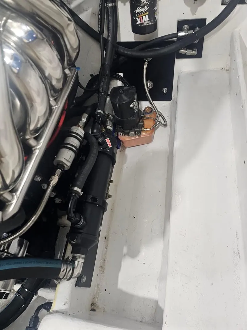 Slide: The Image of Engine compartment of a 2003 Ultimate Warlock 29 World Class Offshore Race boat. - 30