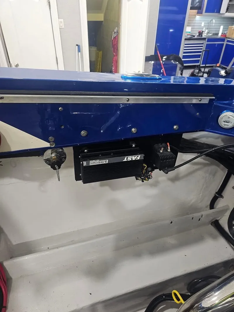 Slide: The Image of 2003 Ultimate Warlock 29 World Class Offshore Race boat interior with blue panel and equipment. - 31