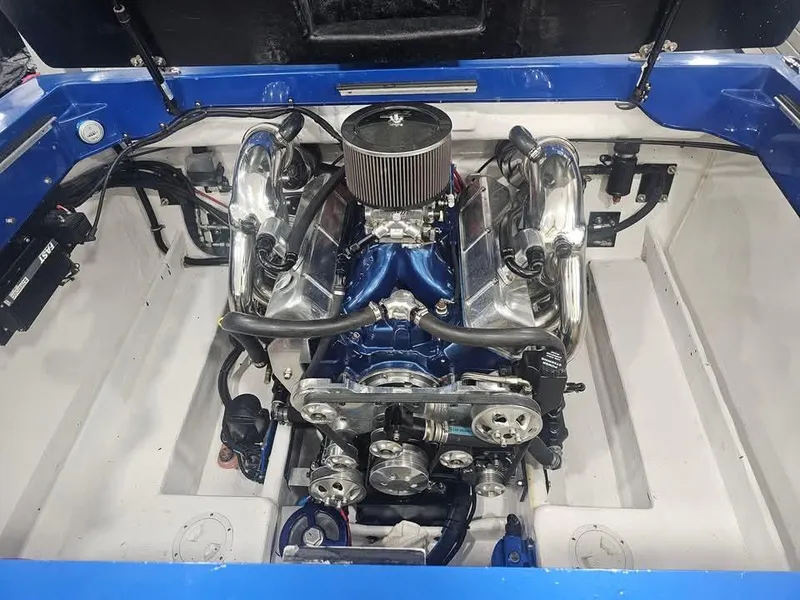 Slide: The Image of Engine of 2003 Ultimate Warlock 29 World Class Offshore Race boat, featuring chrome components. - 34