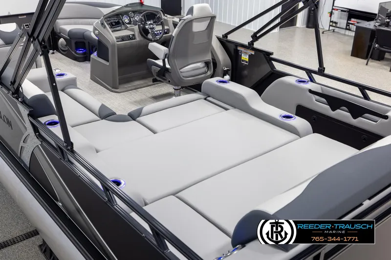 Slide: The Image of 2025 Avalon LSZ Vrl boat interior with plush seating and modern dashboard. - 11