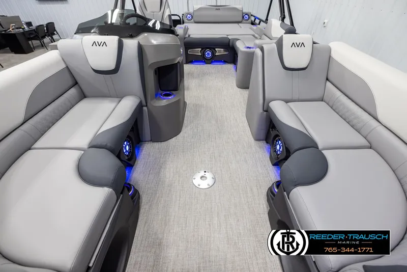 Slide: The Image of 2025 Avalon LSZ Vrl boat interior with modern seating and ambient blue lighting. - 13