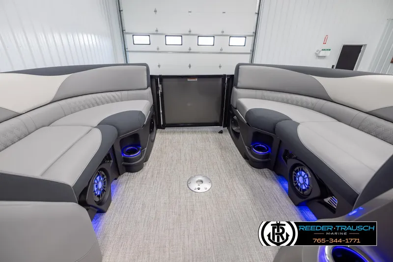 Slide: The Image of Interior of 2025 Avalon LSZ Vrl boat with plush seating and blue LED lighting. - 18