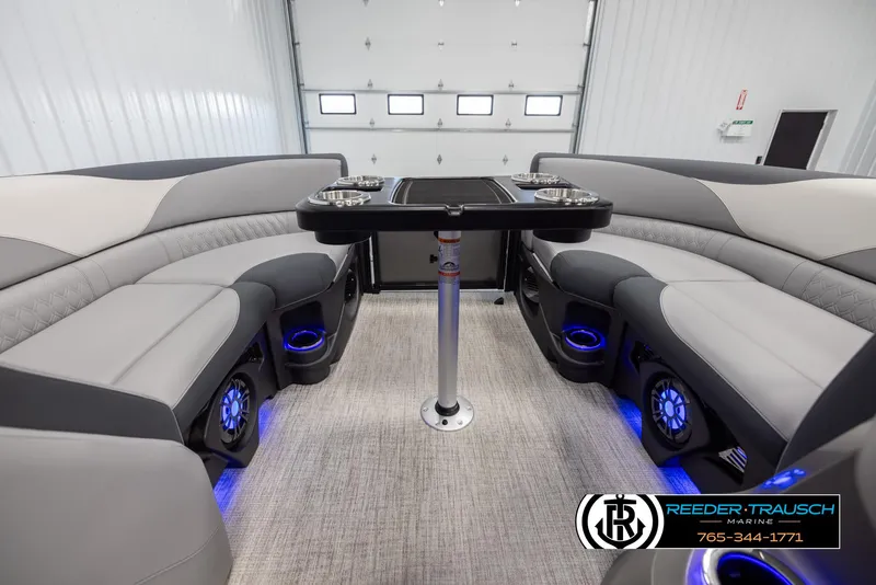 Slide: The Image of Interior of 2025 Avalon LSZ Vrl boat with modern seating and blue LED lighting. - 20