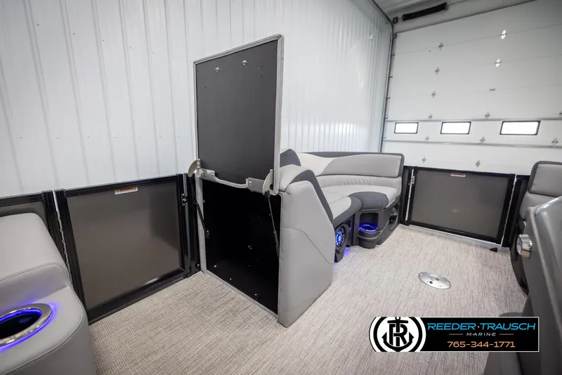 Slide: The Image of Interior of 2025 Avalon LSZ Vrl boat with modern seating and blue LED lighting. - 22