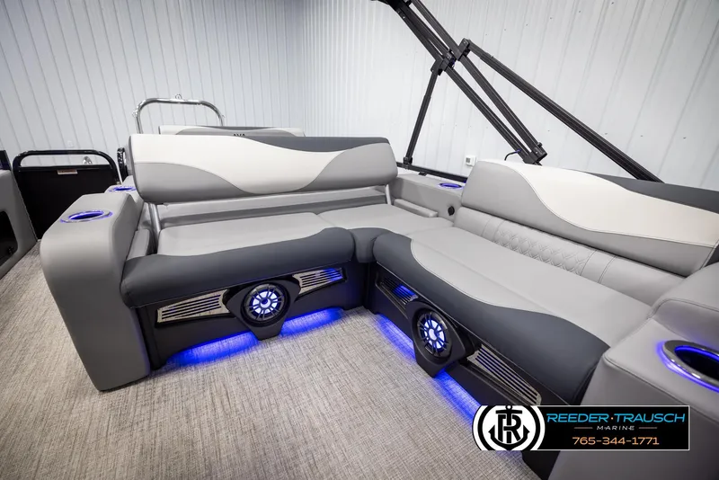 Slide: The Image of 2025 Avalon LSZ Vrl boat interior with modern seating and blue LED lighting. - 24