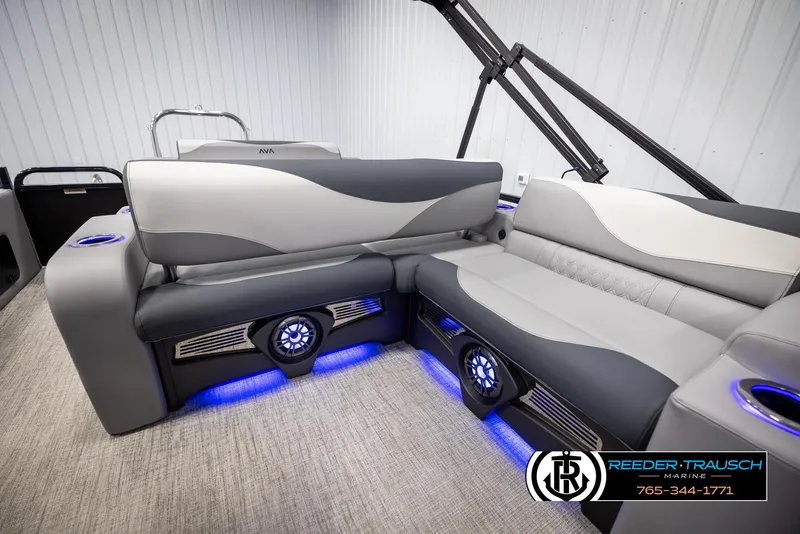 Slide: The Image of 2025 Avalon LSZ Vrl boat interior with gray seating and blue LED lighting. - 25