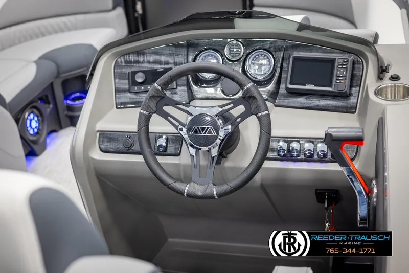 Slide: The Image of 2025 Avalon LSZ Vrl boat dashboard with steering wheel and control panel. - 28