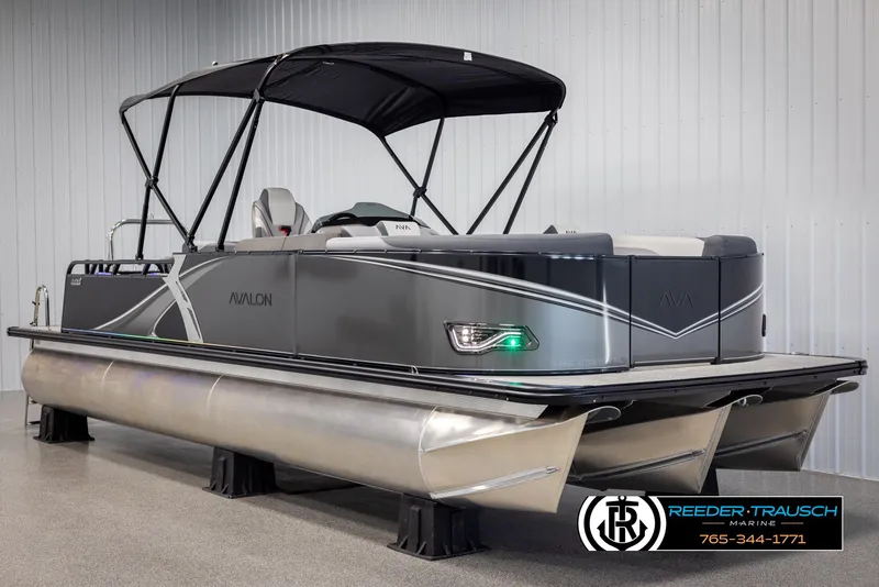 Slide: The Image of 2025 Avalon LSZ Vrl pontoon boat with canopy in showroom. - 3