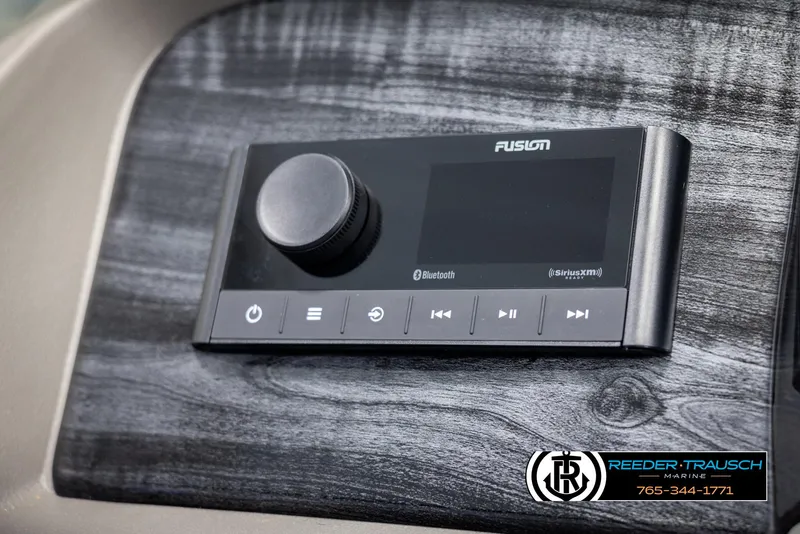 Slide: The Image of 2025 Avalon LSZ Vrl dashboard with Fusion audio system and Bluetooth connectivity. - 32