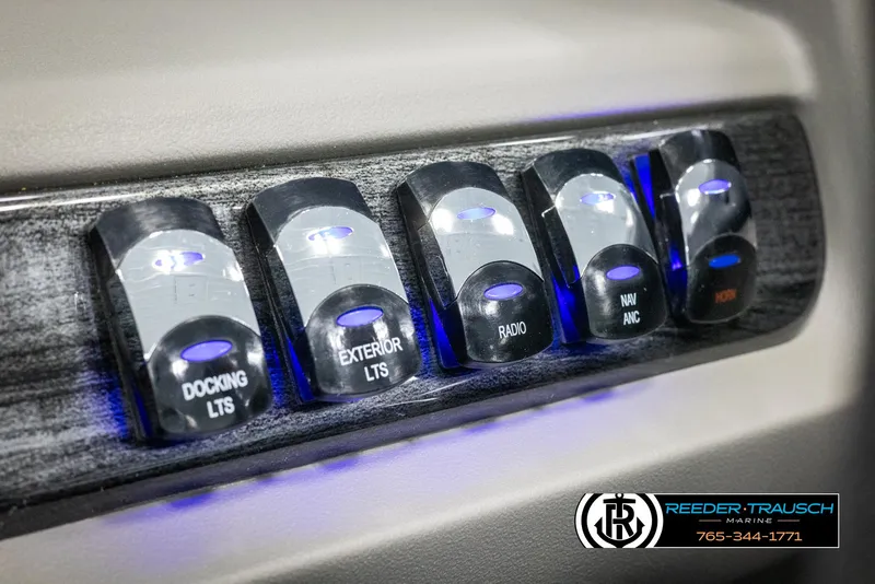 Slide: The Image of Control panel of 2025 Avalon LSZ Vrl with illuminated switches for docking, exterior lights, and more. - 35