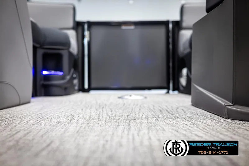 Slide: The Image of Interior view of 2025 Avalon LSZ Vrl boat, featuring plush carpet and modern seating. - 44