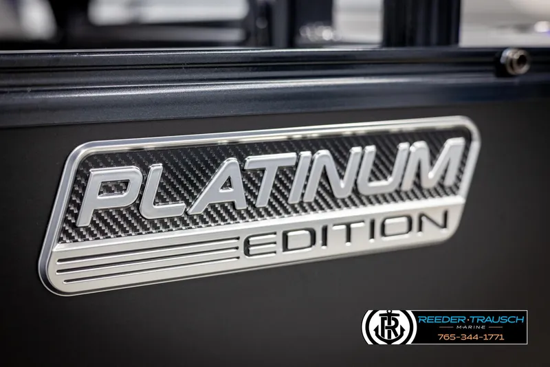 Slide: The Image of 2025 Avalon LSZ Vrl Platinum Edition badge with carbon fiber texture. - 49