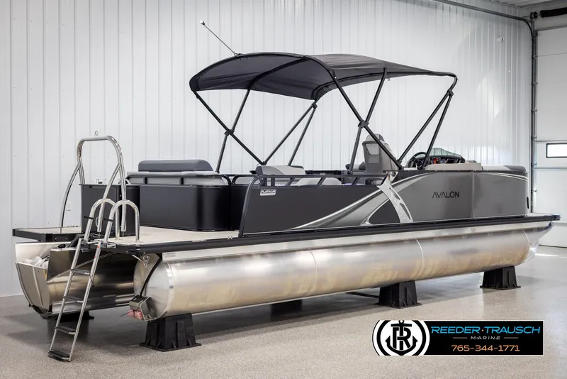 Slide: The Image of 2025 Avalon LSZ Vrl pontoon boat with canopy in showroom. - 6