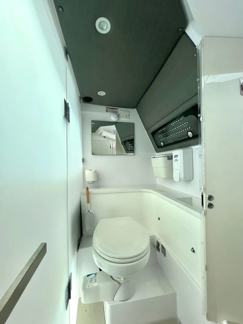 Slide: The Image of 2021 Axopar 37 XC Cross Cabin bathroom with modern fixtures and sleek design. - 20