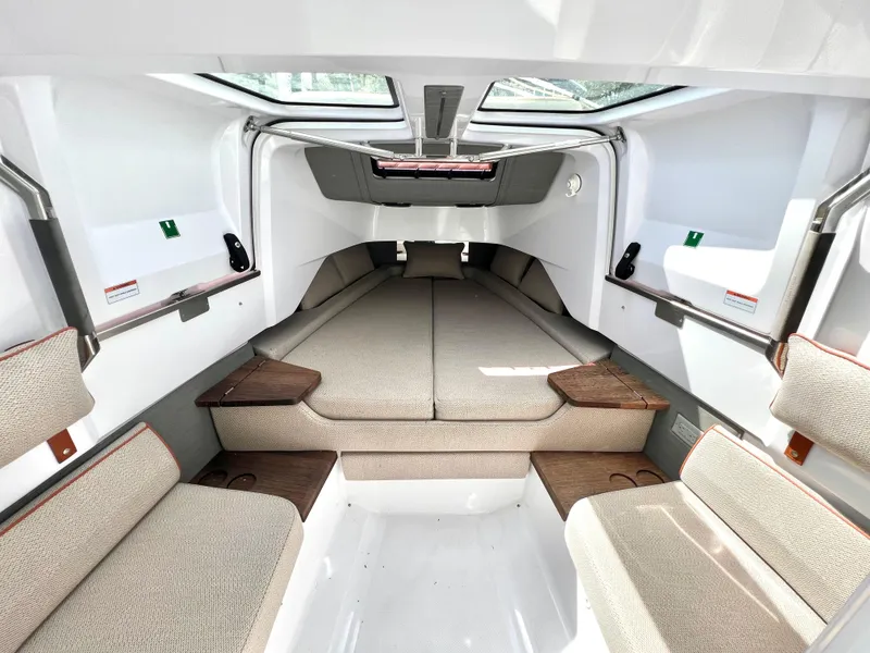 Slide: The Image of 2021 Axopar 37 XC Cross Cabin interior with seating and skylight. - 22