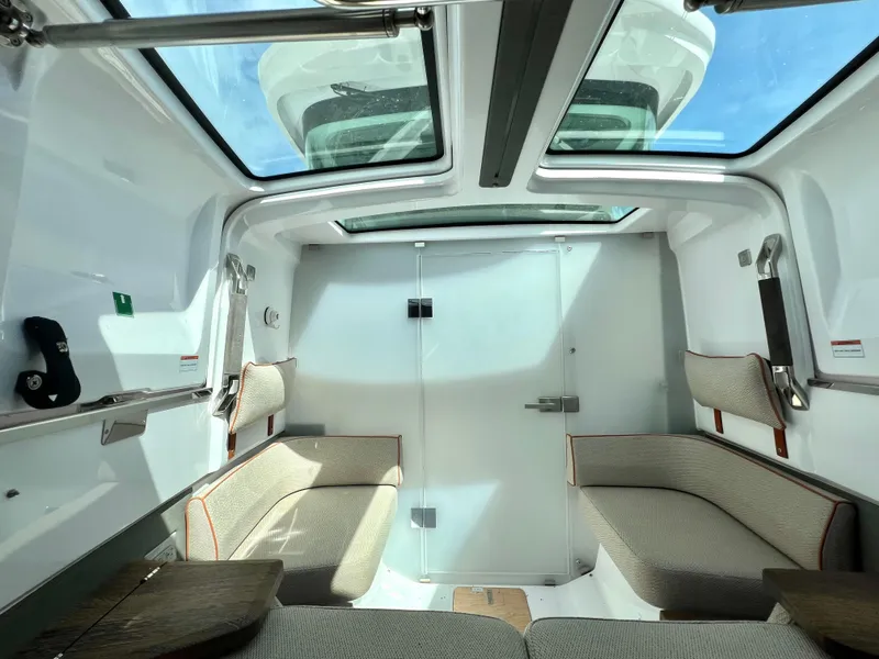 Slide: The Image of Interior of 2021 Axopar 37 XC Cross Cabin with seating and skylight. - 27