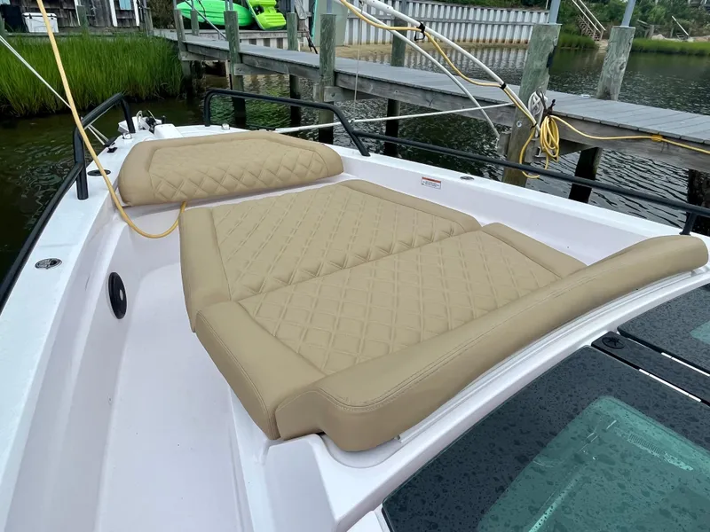 Slide: The Image of 2021 Axopar 37 Cabin Wet Bar with tan cushioned sunbed on deck. - 38