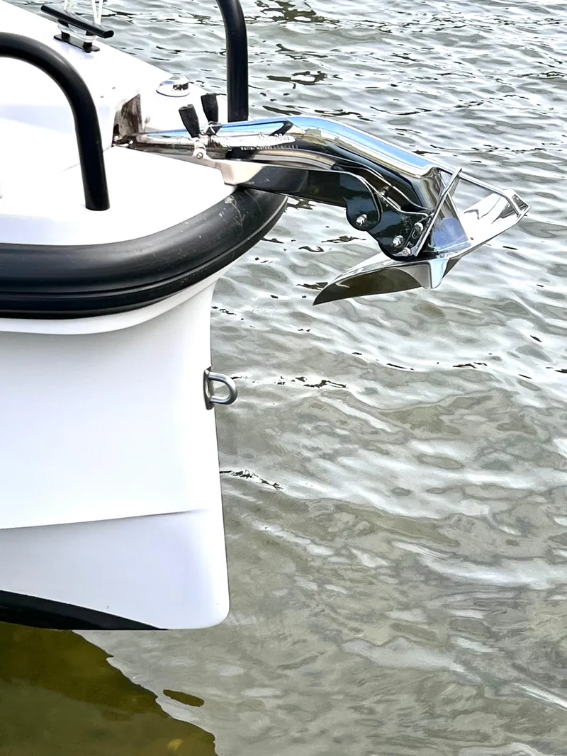 Slide: The Image of 2021 Axopar 37 XC Cross Cabin boat anchor detail on water. - 41
