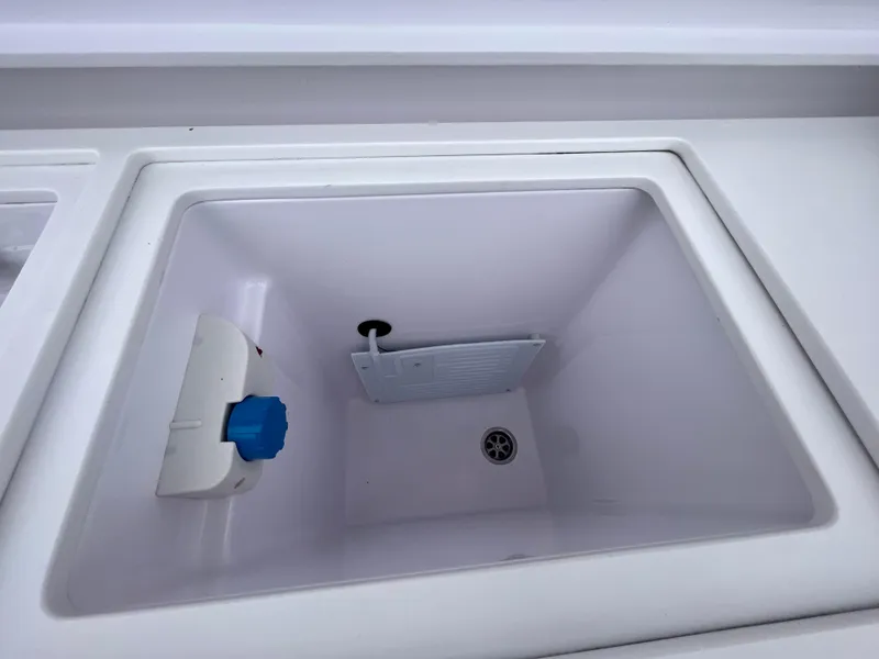 Slide: The Image of 2021 Axopar 37 Cabin wet bar sink, featuring a clean, white interior design. - 48
